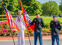 Military members holding flags