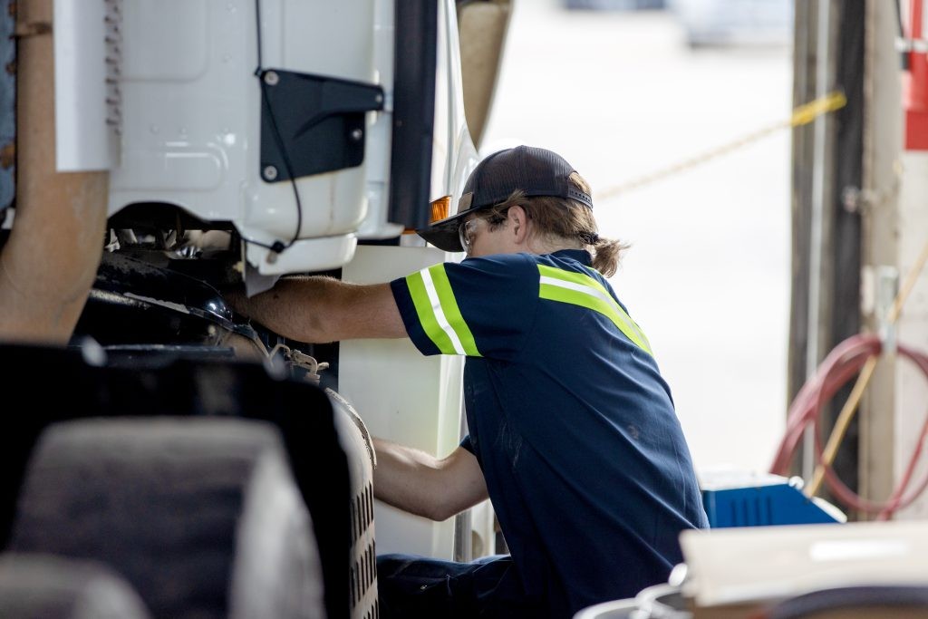 J.B. maintenance tech working on a truck.