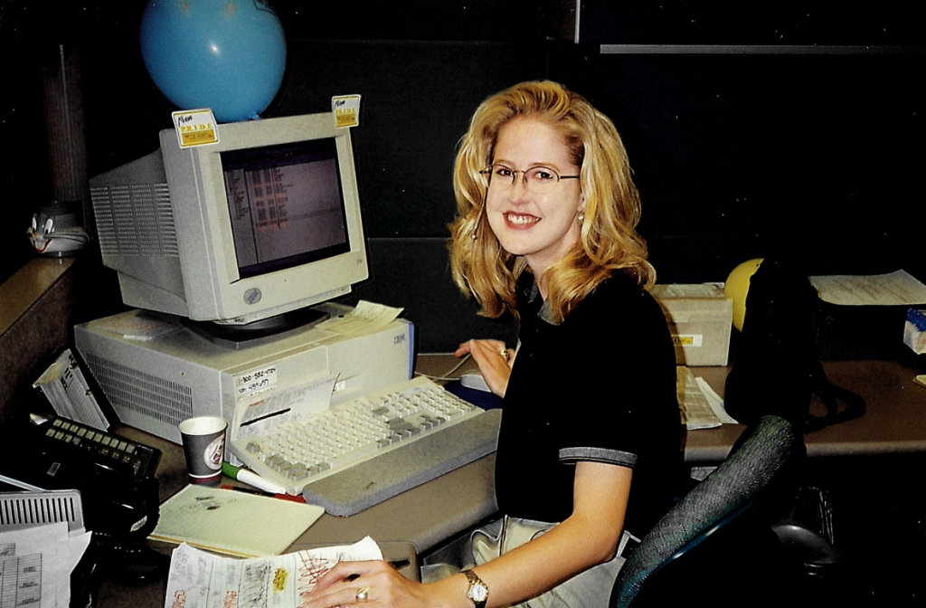 J.B. Hunt employee sitting in front of crt computer monitor