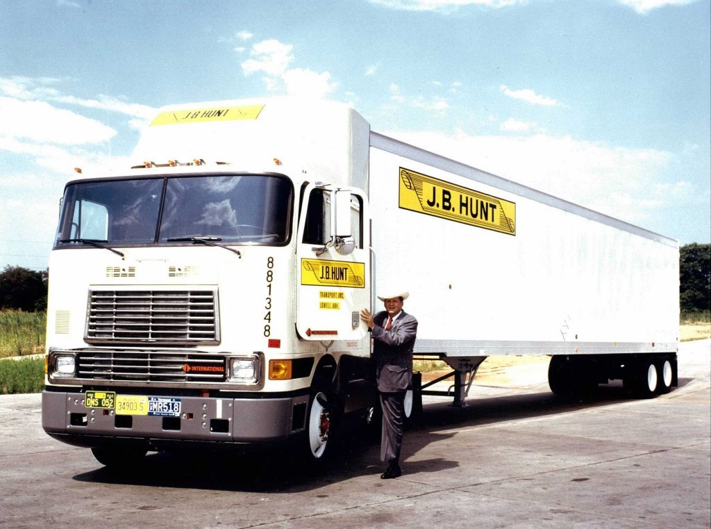 J.B. Hunt standing beside a white J.B. Hunt truck
