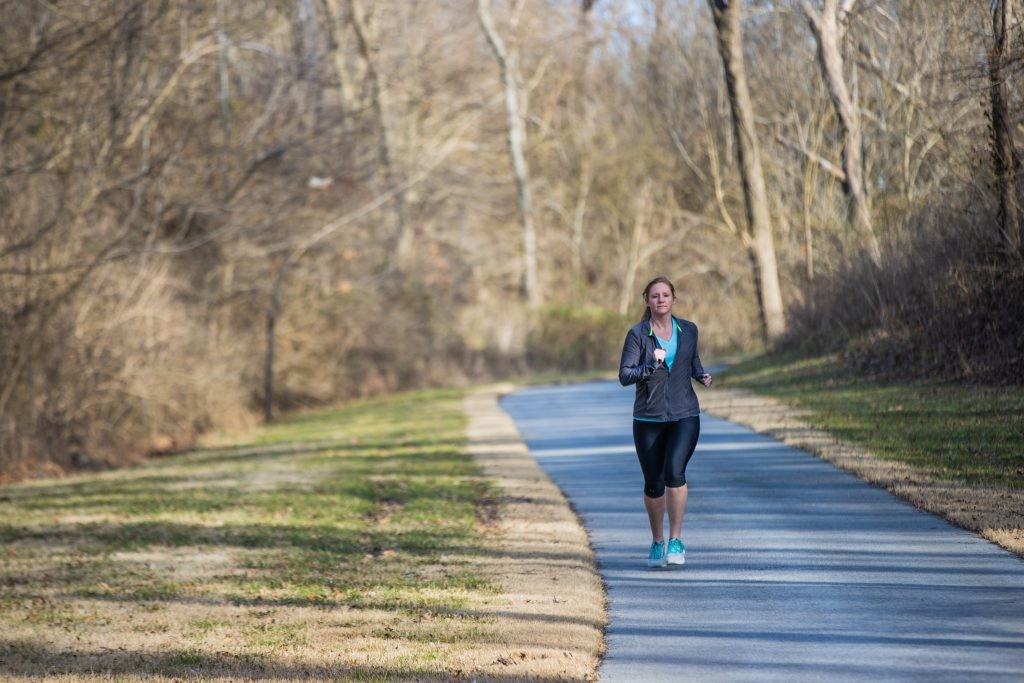 Runner on jogging trail outside of J.B. Hunt headquarters