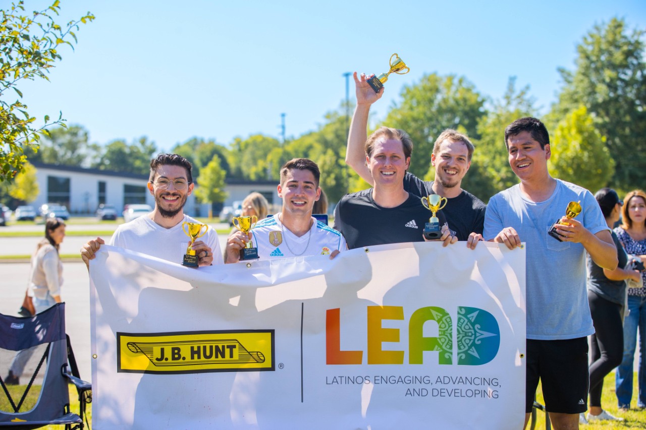 Members of the LEAD employee resource group posing for a photo after a soccer tournament.