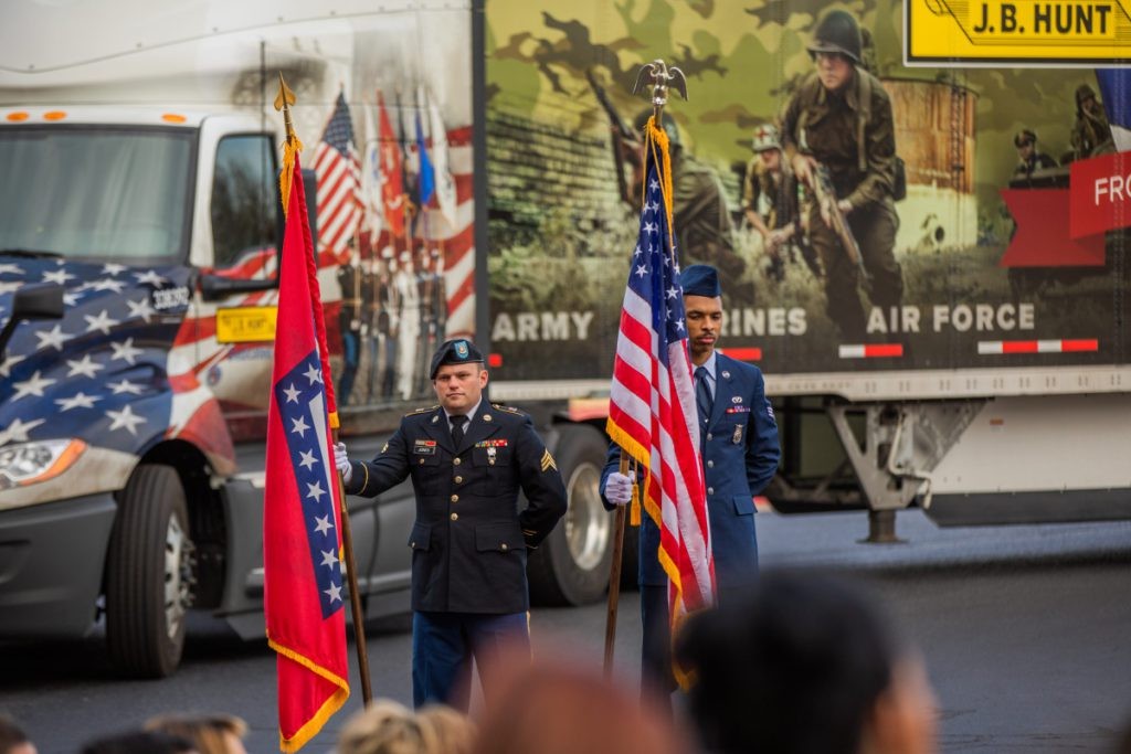 J.B. Hunt employees present the flags