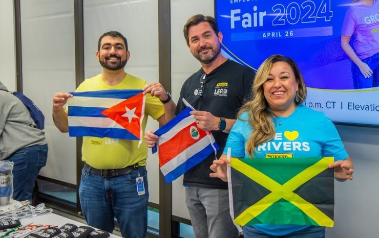 LEAD members holding flags Three LEAD members holding flags for Cuba, Costa Rica and Jamaica