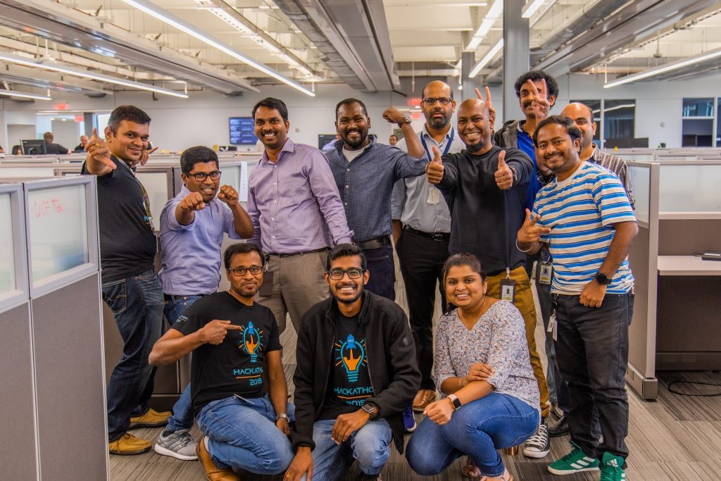 A group of J.B. Hunt engineering and technology employees posing for a picture.