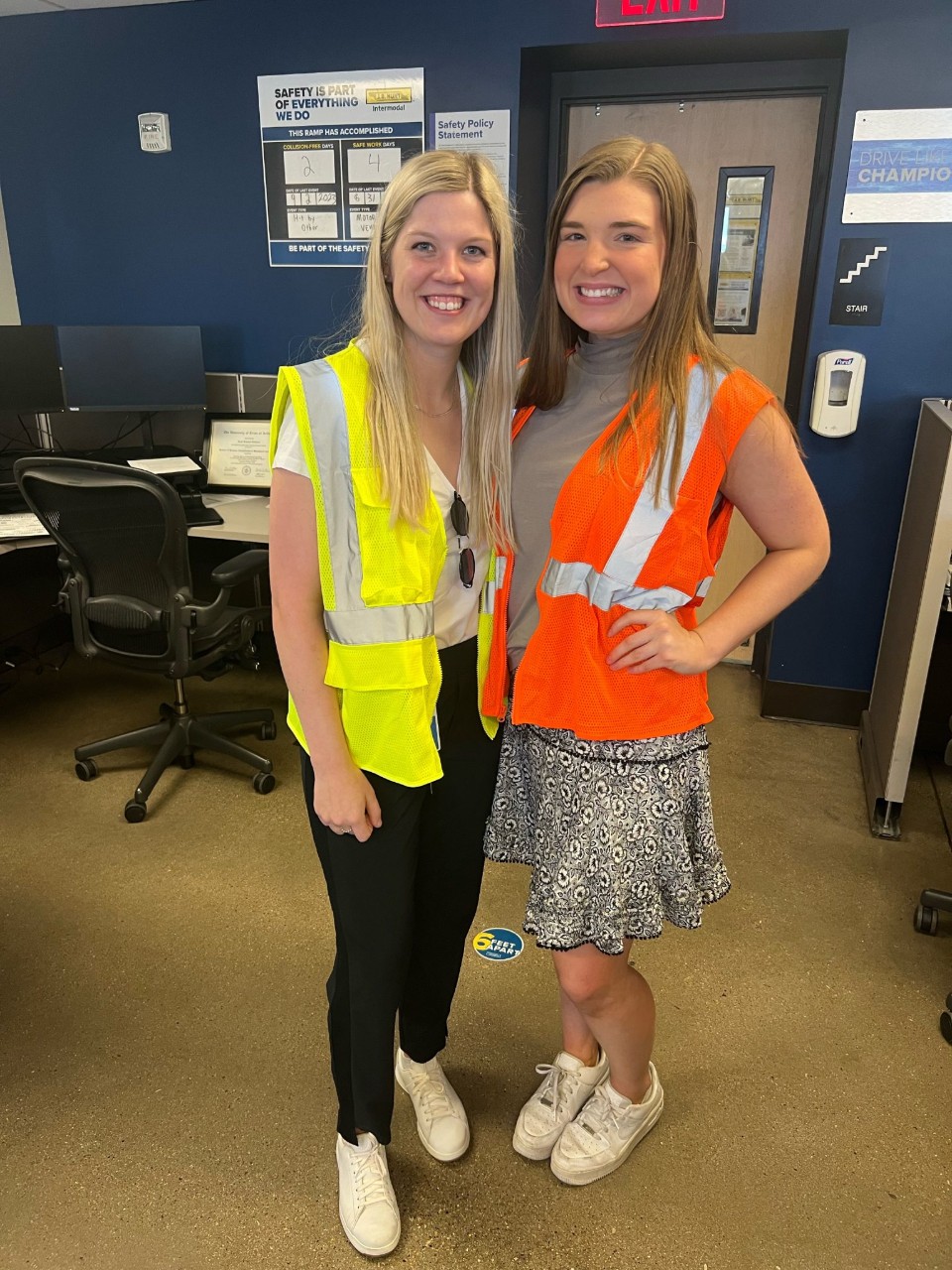 Manager Trainee participant, Abby, posing with a coworker.