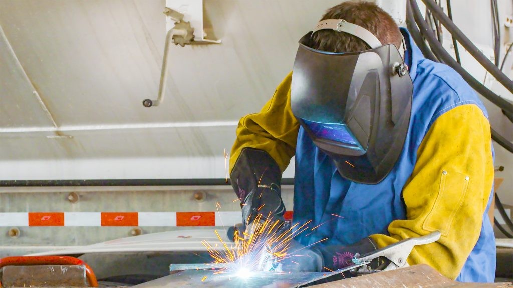 J.B. Hunt maintenance technician welding.
