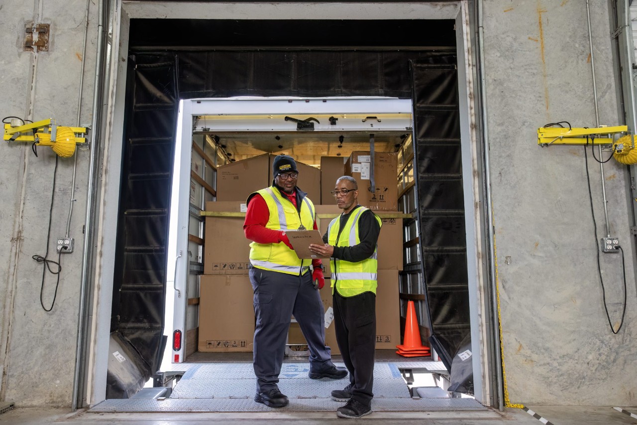 J.B. Hunt warehouse employees working together on project.