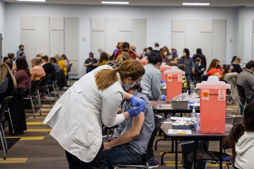Nurse administers COVID-19 vaccine to J.B. Hunt employee.