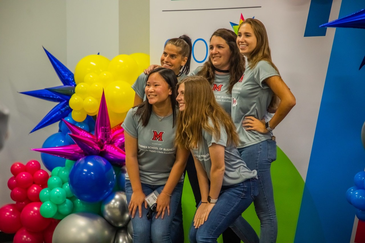 A group of women posing for a photo at a J.B. Hunt GROW ERG event.