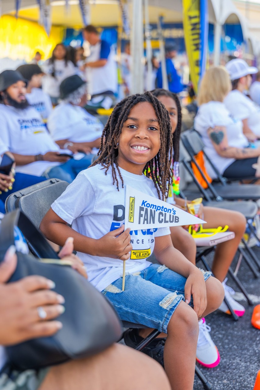Little boy supporting his father, a J.B. Hunt driver, at the Arkansas Truck Driving Championship.