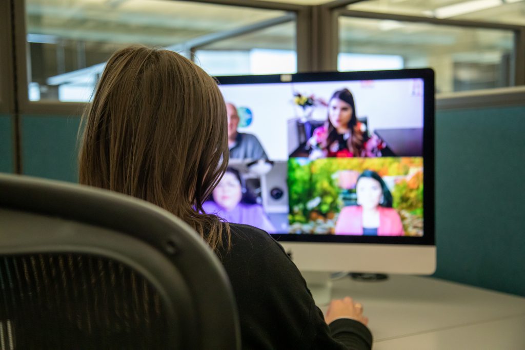 J.B. Hunt employee attends LEAD virtual event sitting at her desk, while looking at her computer screen.