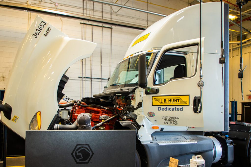 J.B. Hunt Dedicated Contract Services (DCS) truck having mechanical work done in a company shop.