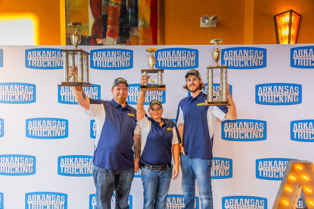 J.B. Hunt technicians holding up trophies at maintenance tech awards