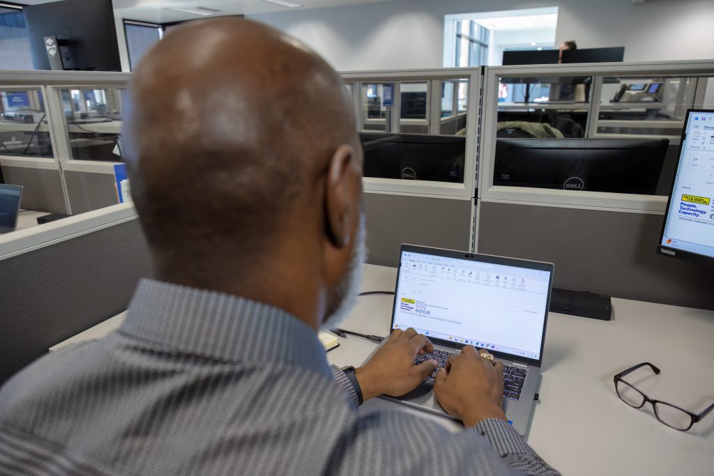 J.B. Hunt employee working at his desk.