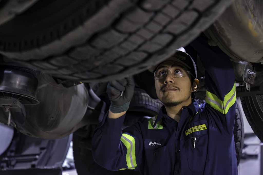 J.B. Hunt maintenance technician working on company equipment.