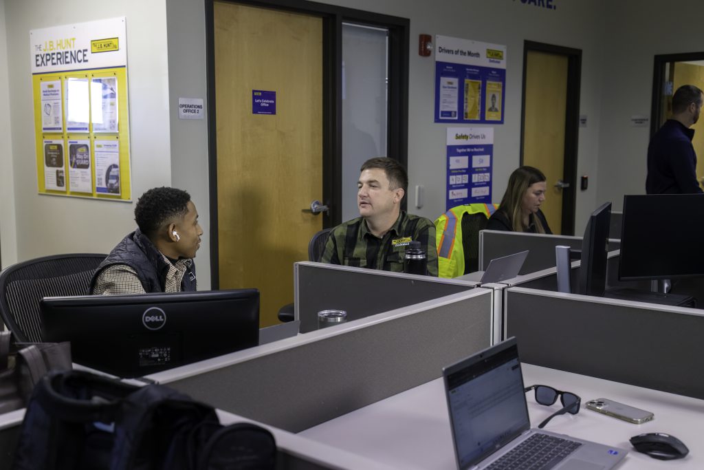 J.B. Hunt employees at our Joliet location working together to solve customer issues.