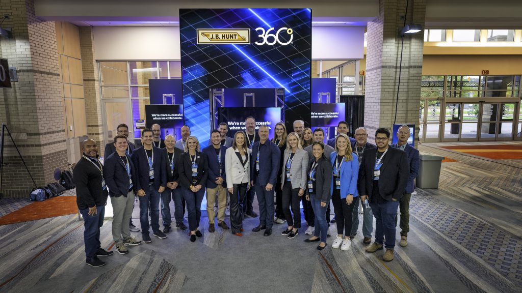 Shelley Simpson, J.B. Hunt CEO and President, posing with J.B. Hunt sales professionals as well as Spencer Frazier, Executive Vice President of Sales and Marketing at J.B. Hunt at 2024 FreightWaves.