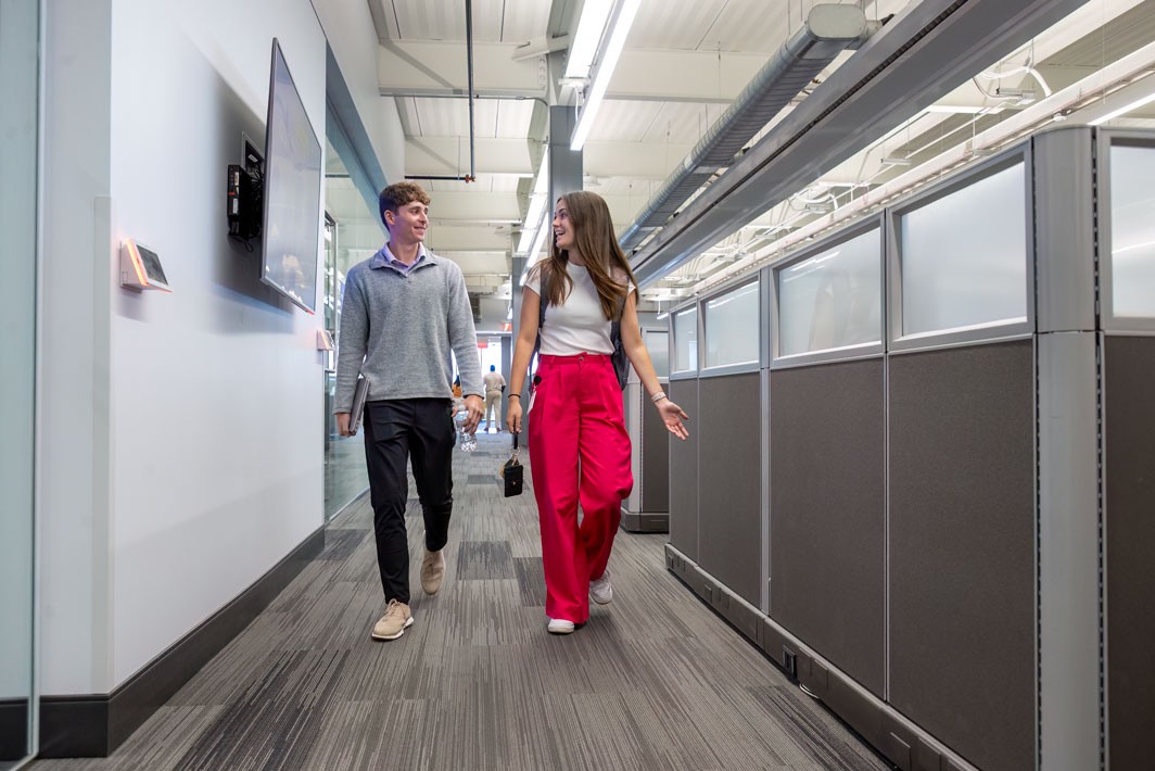two interns walking down a hall at J.B. Hunt corporate campus